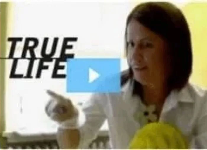 Isa Herrera in a white coat pointing toward camera during an MTV True Life segment.
